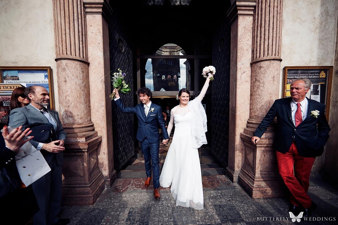 Mr. and Mrs. at destination catholic wedding ceremony in Prague