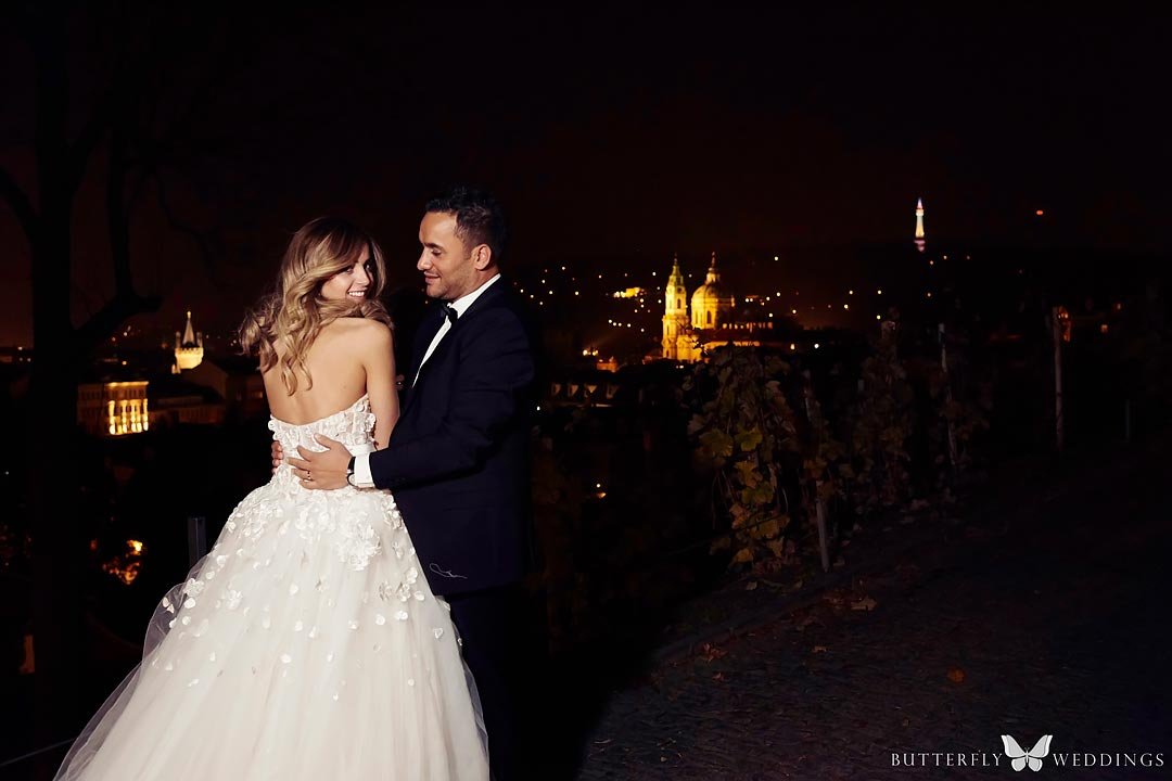 Bride and groom photos with night Prague, destination wedding in Prague