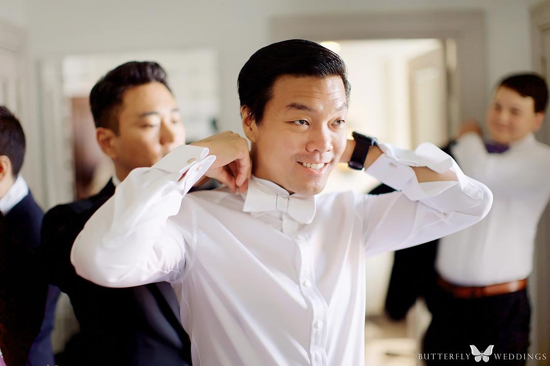 Groom is getting ready at destination wedding in Prague