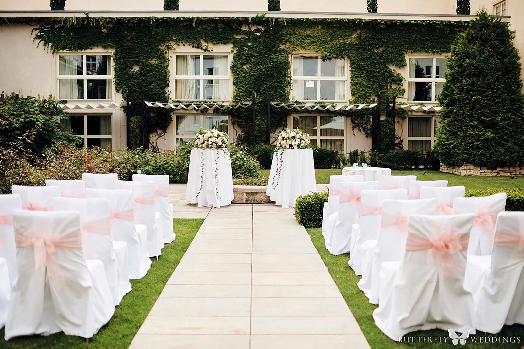 Wedding ceremony in garden in Mandarin Oriental hotel Prague